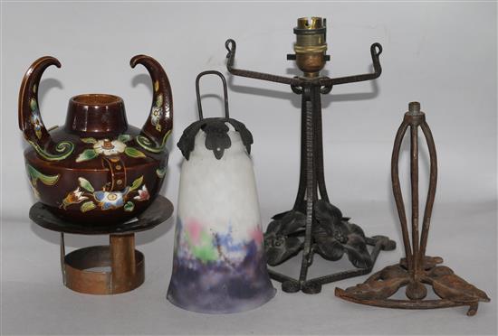 Two Art Nouveau wrought iron lamp bases, an Arts & Crafts copper stand and a Continental pottery vase